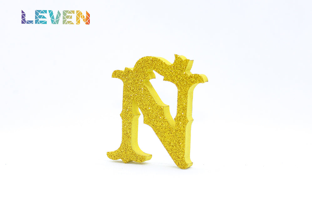 Letras decorativas 7cm Oro purpurina Ñ
